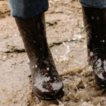 Boots being washed after a trip to the chicken coop